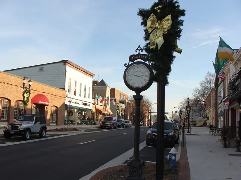 A street clock and brick storefronts on Main Street in Bel Air, Maryland, photographed in winter 2008